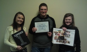 Journalism students display the 2012 Javelin and its Jostens-IHSPA award.