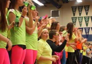Atlantic students show school spirit by dressing in neon colors at the sub-state game against Harlan. Dressing alike promotes unity.