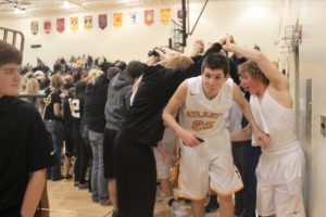 Everyone loves a good tunnel!  An ecstatic portion of the student body congratulates the boys after a 56-41 win over the Creston Panthers. 