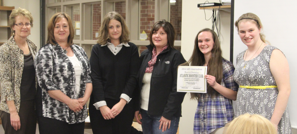 Atlantic Booster Club officers   Val Gifford, Shiela Svoboda, Crystal Christensen and Kelly Monson receive thanks from yearbook editors Kristin Johnk and Breanna Kixmiller. The ACSD Booster Club donates $3000 to AHS Journalism each year.