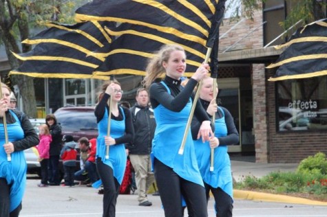 The AHS Color Guard leads the band for their performance in the parade. The color guard has a range of girls from freshman all the way up to a few seniors.