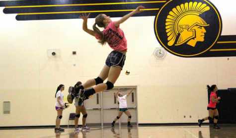 Junior volleyball player Skye Thompson attempts her killer jump serve. Thompson leads the Atlantic volleyball team in kills and serve aces. The junior also plays the position of an outside hitter. 