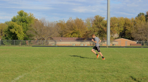 Sophomore Brennen Smith strides out during his cool down after a day of practice. There are over 25 boys on the cross country team this year. The teams best finish this season was fourth place.