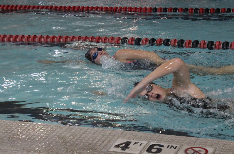Senior Brienna Steffens and junior Lileigh Brown are members of the AHS swim team competing at Regionals on Saturday.
