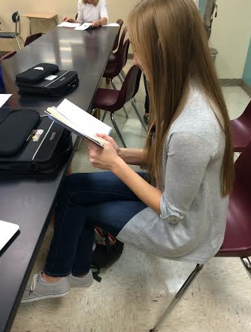 Senior Erin Shannon reads a book in her free time. 