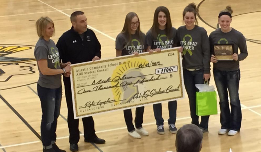 Here are Student Council members seniors Erin Shannon, Jenny Hohenberger, Steph Freund, and junior Laeni Pelzer presenting Mitch Osborn with a check of $1100.  This picture was taken from Osborns Twitter in a tweet thanking Atlantic for the generous donation.  