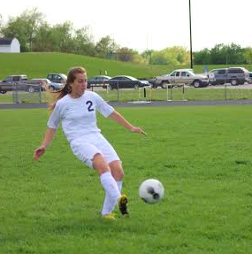 Junior Emily Hohenberger kicks the ball up the field. (File Photo 2015)