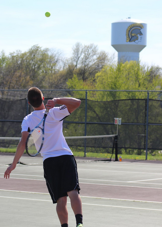 The boys tennis team won against the Harlan Cyclones.  Senior Nick Podhajsky (pictured above) won both his singles and double match.