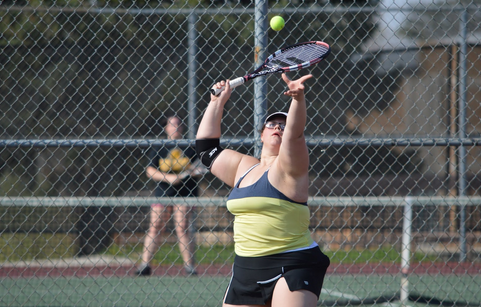 Senior Grace Jacob serves the ball during practice.  Jacob has participated in tennis all four years of high school.  She is one of the two seniors on the team.