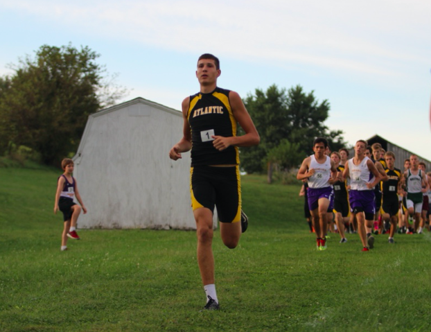 Senior Ryan Hawkins leads the pack at a cross country meet earlier this season. Hawkins was a state qualifier, and ran at the state meet this year. 