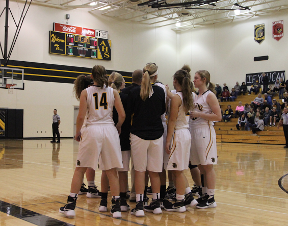 The Atlantic girls basketball team breaks down from their huddle before the game against Winterset. The girls are 4-0.