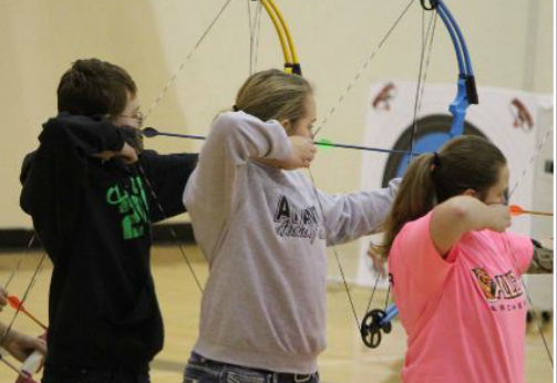 Nathan Gray and Heather Freund site in alongside their competition at a home archery meet last year.