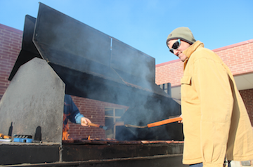 HEATING UP - Cass County Beef Producer Todd Russell flips burgers during lunch.