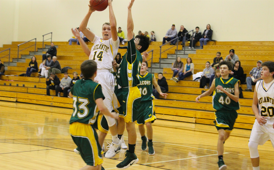 Freshman Tyler Moen goes up for two during the game against St. Albert. Moen had four points after the Creston game. 
