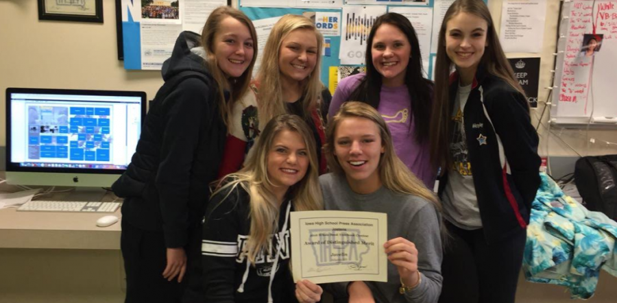 HARD WORK PAYS OFF - Students in first-period Yearbook Editing celebrate the Award of Distinguished Merit from the Jostens-IHSPA Yearbook Critique and Contest. The award was given to the 2016 book on Dec. 19. This is the second time in three years the Javelin has earned this notable award.