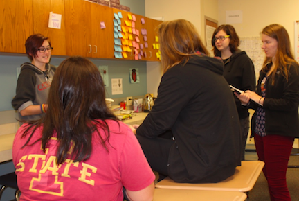 LISTEN CLOSELY - Sophomore student Chamilla Colton talks about her project in English 2. “Her story was very awesome and detailed. She deserved an A,” sophomore Hannah Maley said. Maley was sitting on the desk. Rachelle Lipp listened and asked questions. Lipp is a new teacher and it was her first time teaching this year.