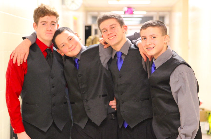 BONDING BOYS-Male members of Premiere and Diversity prepare to take the stage for Swing Inn. The concert was held Jan 12 and serves as a way to prepare students for the upcoming competition season. DCG is the first competition of the season.