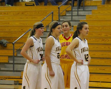 Sophomore Baylee Newell, Seniors Brooke Newell and Emily Hohenberger await the throw in vs. Kuemper earlier this season. 