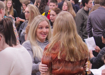 GETTING INTO THE RIGHT MIND SET, Speech coach Trisha Niceswanger consoles with student to help calm her nerves. 