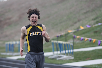 TONGUES OUT FOR HURDLES- Junior Gratt Reed gets pumped up before the 110 meter high hurdles. Reed went to State last year in the event and placed 8th. 