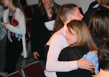 Junior Jaxson Eden hugs his mother Cynthia Andersen at the conclusion of the Every 15 Minutes experience.