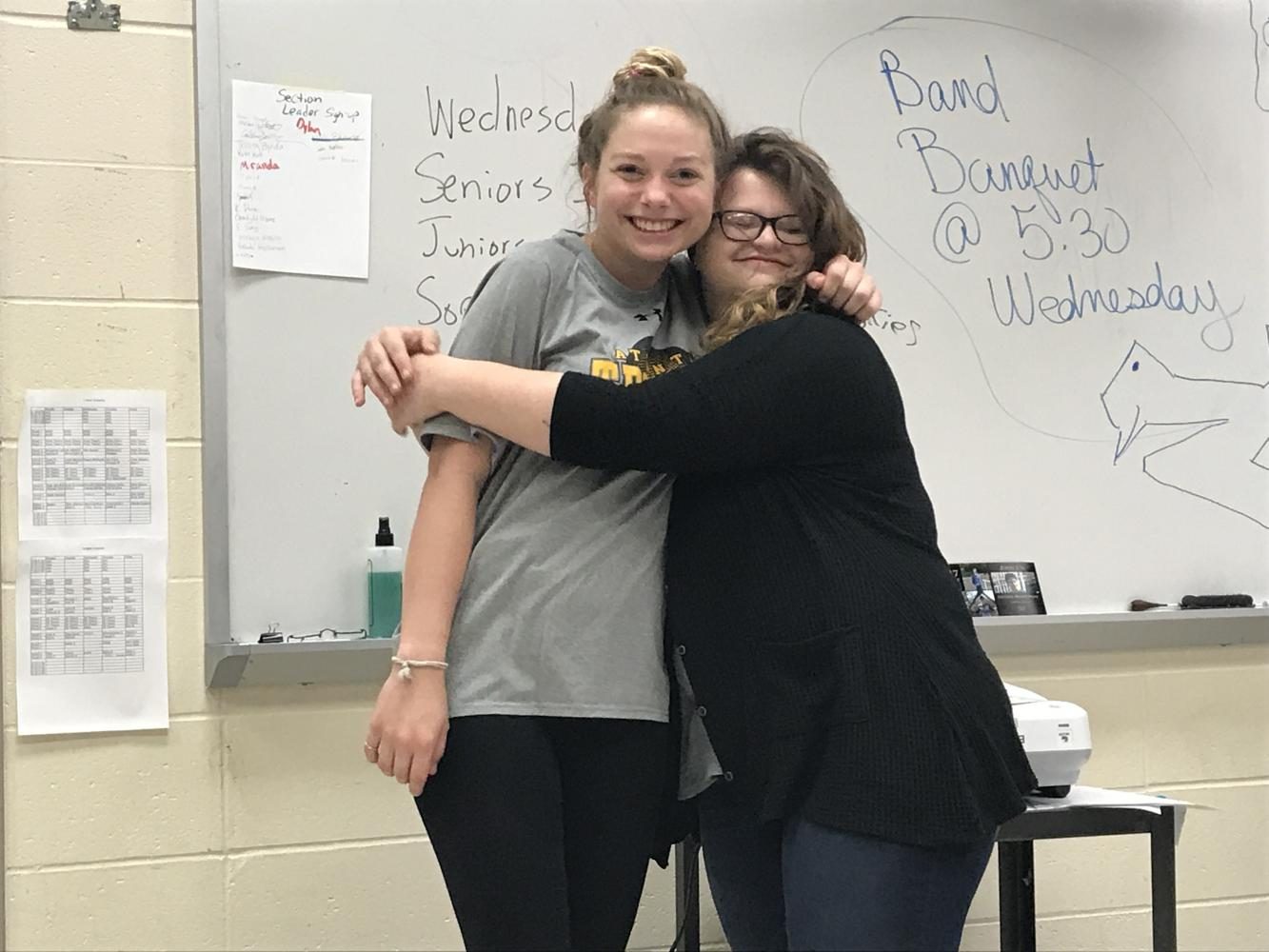 SHOWING EMOTION, the two AHS students who will be attending speech nationals, show their excitement before they perform in front of friends
