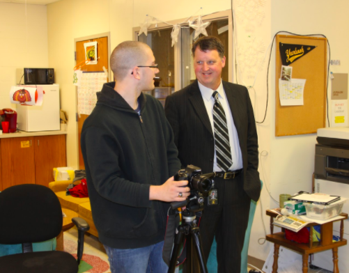 COMMUNICATION- Superintendent Steve Barber talks with journalist Marcus Duranceau. Baber has been active in communicating with staff and students in the district. He has also been seen at many athletics practices and games. 