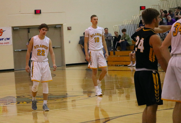 Seniors Jaxson Eden and Austin Alexander await the free throw.