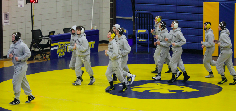 Trojan Wrestlers warm-up to get ready for their tournament.