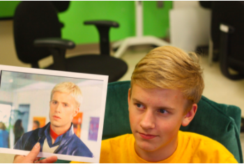 TWINS- Evan Brummer holds a picture of Freddie Prinze, Jr. Brummer is just one of many people of AHS with a look-a-like celebrity. 