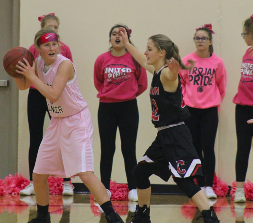 Junior Baylee Newell looks for a teammate to help her out of a sticky situation.