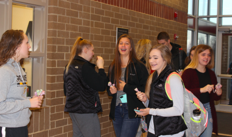 AHS Fuel members greet students on Friday morning.