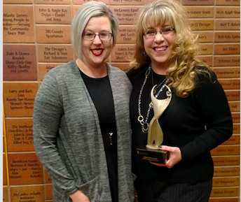 McKay poses with her award and Mallory Kirchhoff who nominated her. 