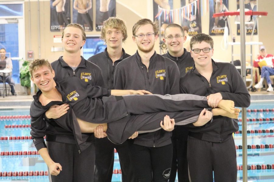 Members of the boys swim team have some fun at their home meet. The meet was held at the YMCA.