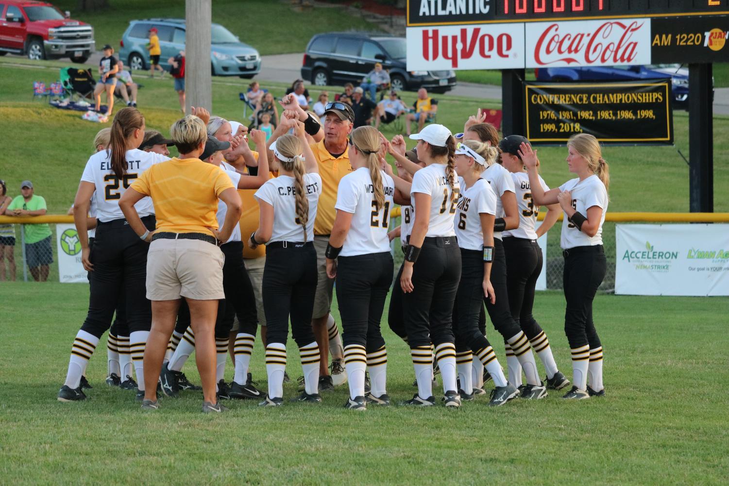 TROJANS ON THREE - The softball players group together at the end of a game to talk before a breakdown. The girls were conference champs and qualified for State.