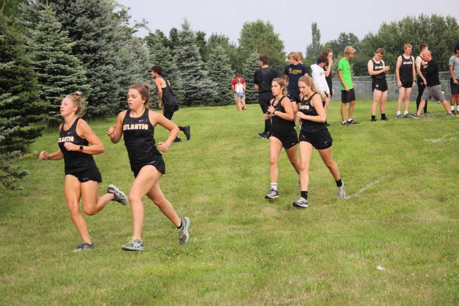 FOLLOW THE LEADER - juniors Corri Pelzer and Kelsie Siedlik and seniors Erin Wendt and Halsey Bailey take off in the first 200 meters of the time trial course. All four have been consistent JV runners for the girls team.