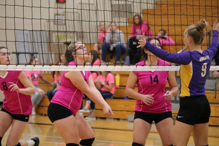 The JV team--decked out in pink--sets the ball up against conference opponent Denison-Schleswig.