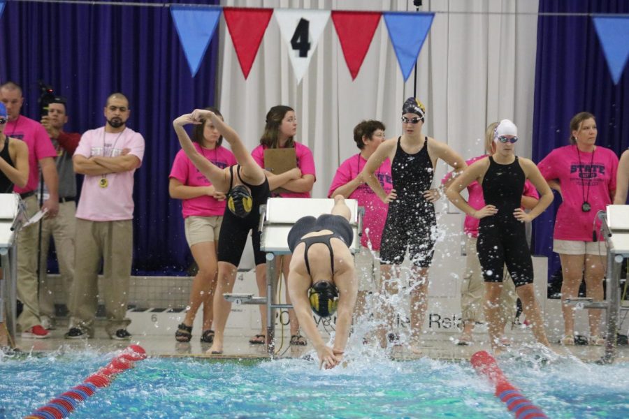 DIVE IN - Members of the girls swim team compete in the 200 Medley relay at the State meet. They placed 14th. 