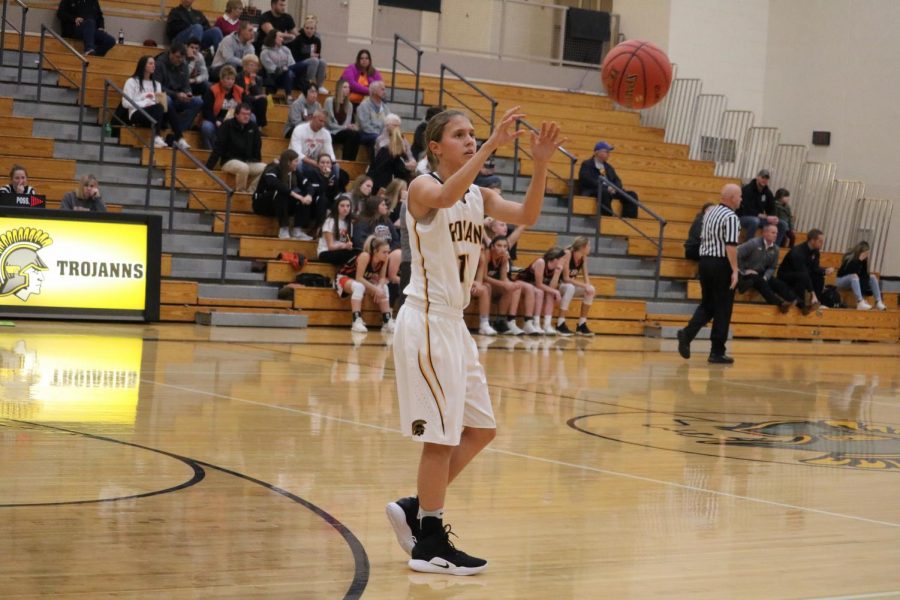 Sophomore Taylor McCreedy snags the ball as it is inbounded. McCreedy plays on both the JV and varsity squads.