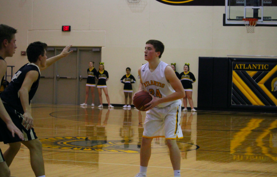 BALL UP - Senior Logan Reilly looks for an opportunity to shoot during the 2017-18 season. 