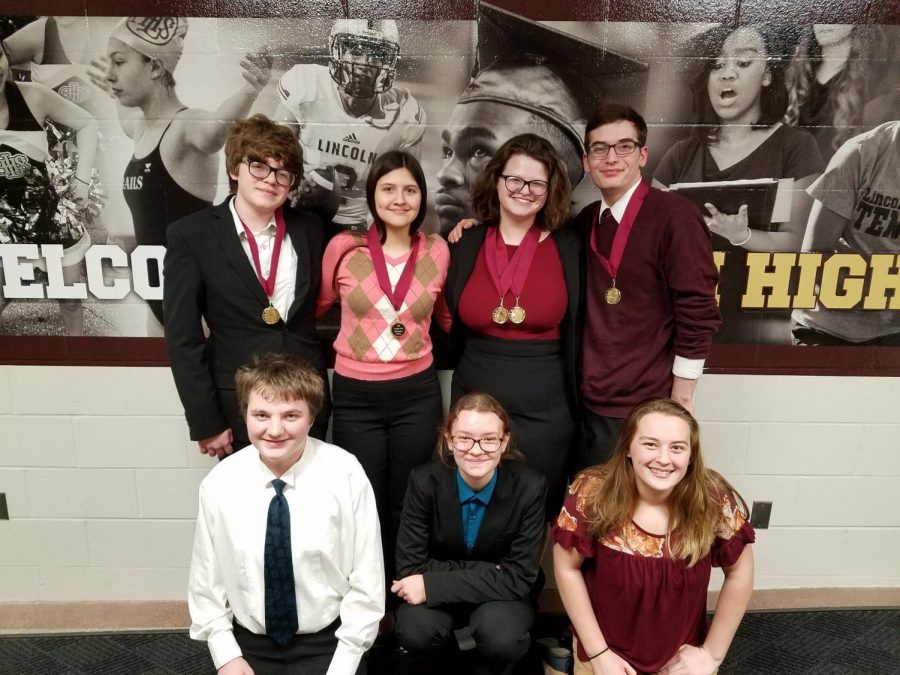 ANOTHER DAY, ANOTHER MEDAL - (top row) Kobe Moss, Genevieve Martinez, Sarah Schorle, Troy Roach, (bottom row) Lane Muell, Carina Birkel and Olivia Engler pose after receiving awards. The Lincoln Railsplitter was the third straight weekend of competing for the AHS speech and debate students.