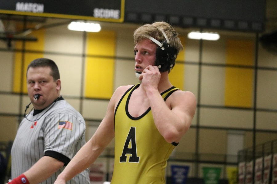 LOOK OF A CHAMPION- Senior Chase McLaren looks to the crowd during his finals match at the Southeast Polk Tournament. McLaren set a new school record for wins at the Council Bluffs Classic and celebrated at the home duals. 