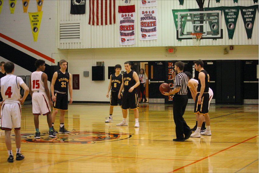 GETTING SITUATED - The Trojans set up their defense before the play begins. 