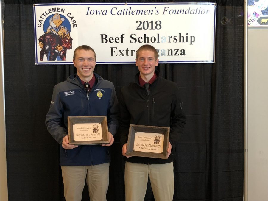 WIDE SMILES- Seniors Tyler Comes and Nathan Behrends proudly show their plaques from the contest. Comes and Behrends earned third place. 