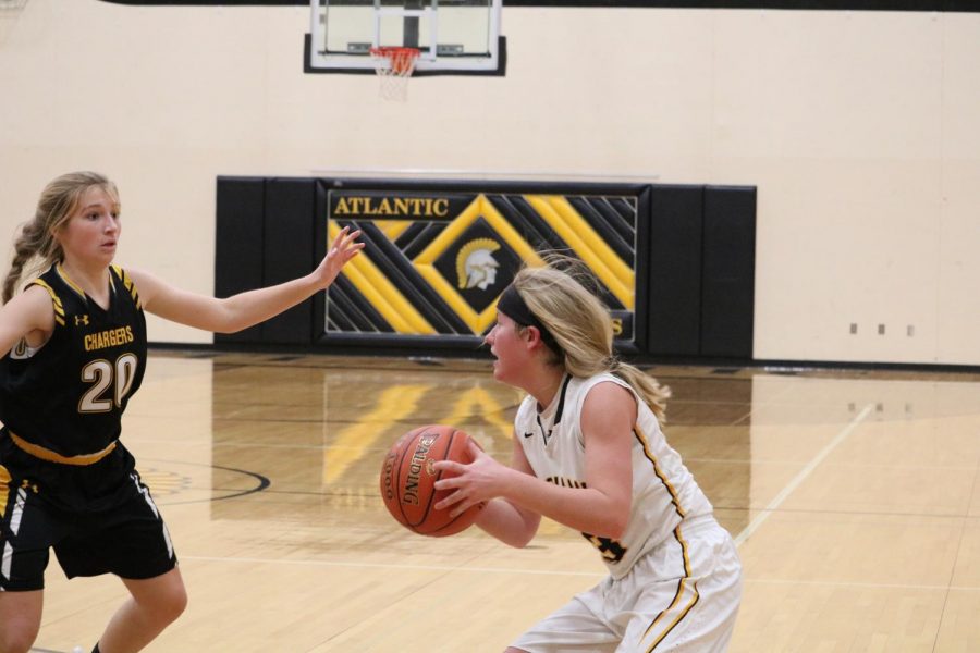 Senior Baylee Newell grips the ball on offense. Against the Cyclones, Newell netted two points and had five steals.