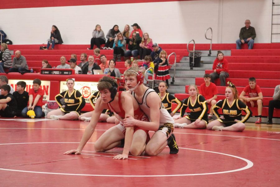 READY TO GO - Freshman Kadin Stutzman waits patiently for the referee to blow his whistle at the Creston dual earlier in the season. Stutzman was one of six to advance to the district tournament.