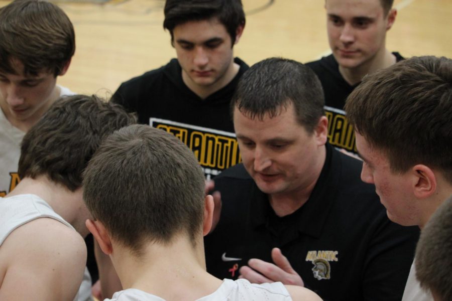 Atlantic head boys basketball coach Jeff Ebling breaks down a play during a timeout. The regular season ends for the Trojan boys on Thursday, as they play Denison-Schleswig at home.