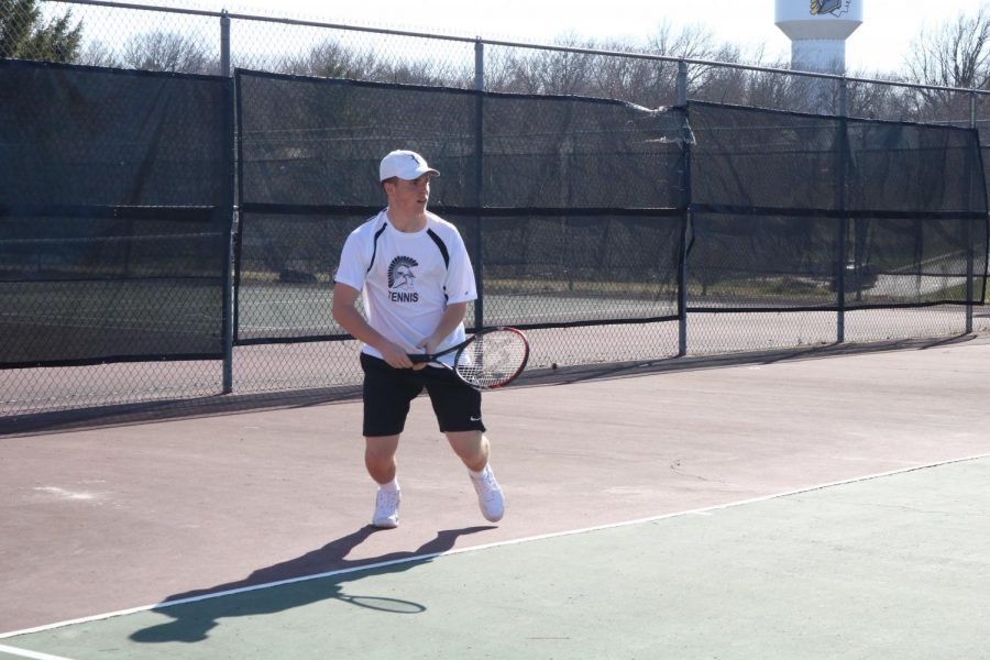Junior Nile Petersen prepares to hit a forehand return to his opponent. This season, Petersen holds down the #1 singles position on the boys’ team.
