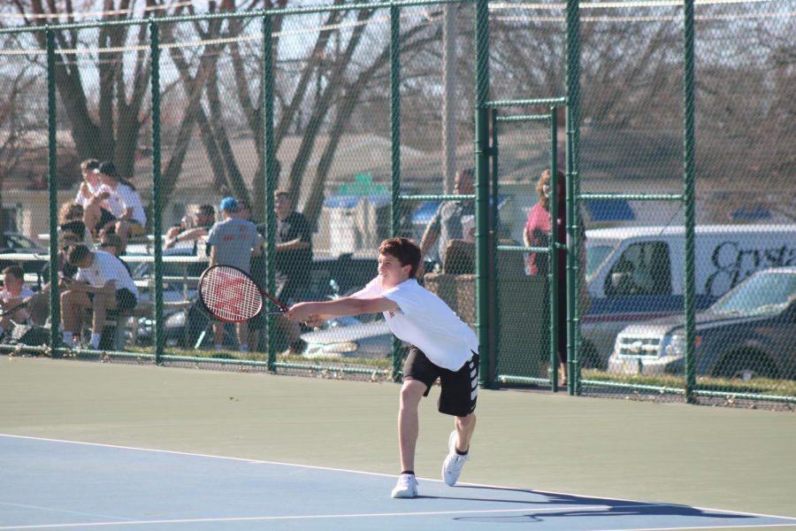 Sophomore Grant Sturm eyes his backhand shot earlier this season. Sturm started the season as a new player, and he has moved his way up to the #5 varsity spot.