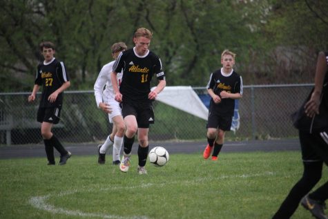 OFFENSIVE MINDSET - Junior Ben Andersen dribbles the ball upfield in the matchup against the Harlan Cyclones. Andersen had a total of four shots in the three games during the week of April 22. 
